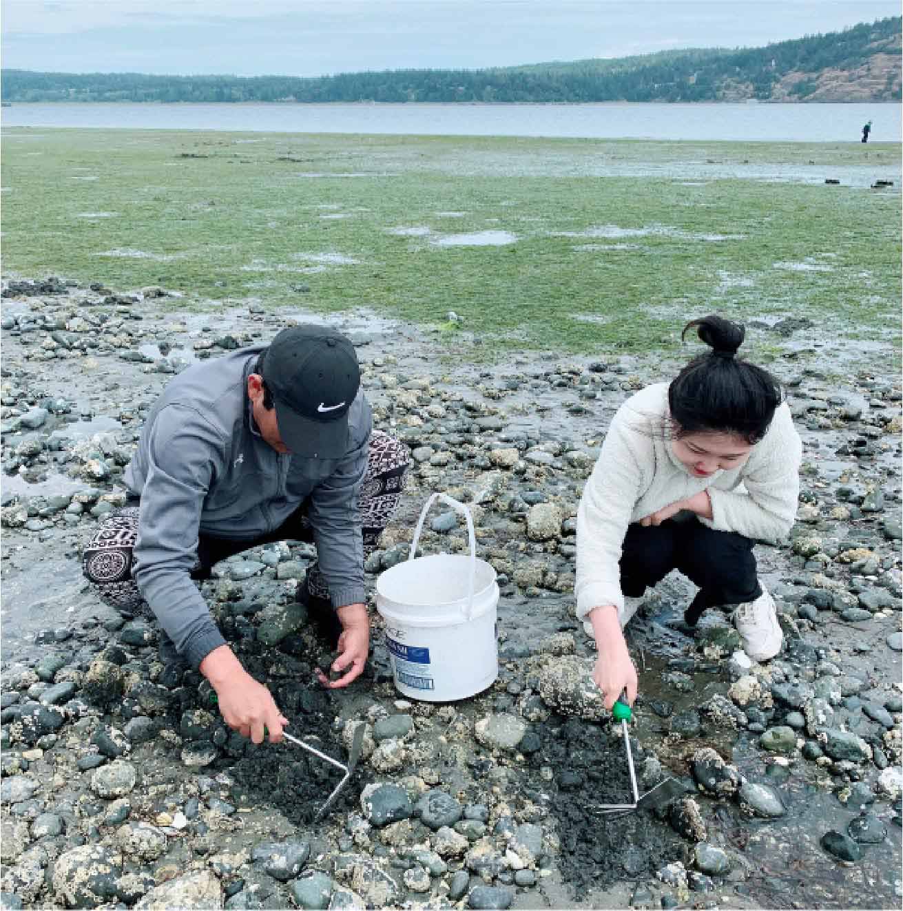 father and daughter in the mud flats